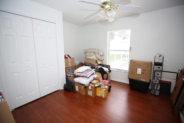 miscellaneous room with ceiling fan and dark hardwood / wood-style floors