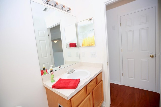 bathroom with wood-type flooring and vanity