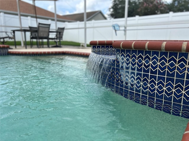 view of pool featuring pool water feature