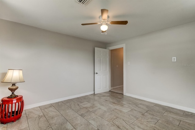 unfurnished room with ceiling fan