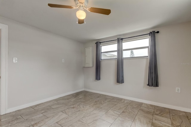 unfurnished room with ceiling fan