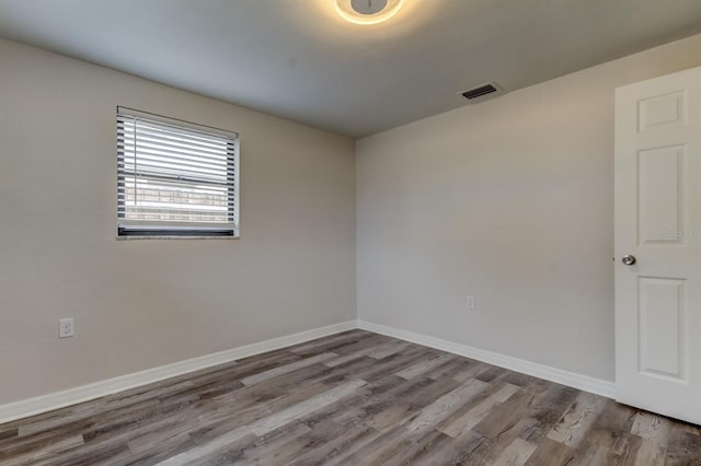 empty room featuring hardwood / wood-style floors