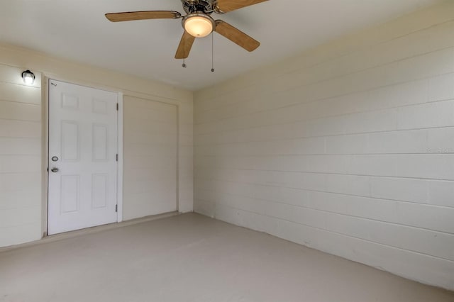 unfurnished bedroom with concrete flooring and ceiling fan