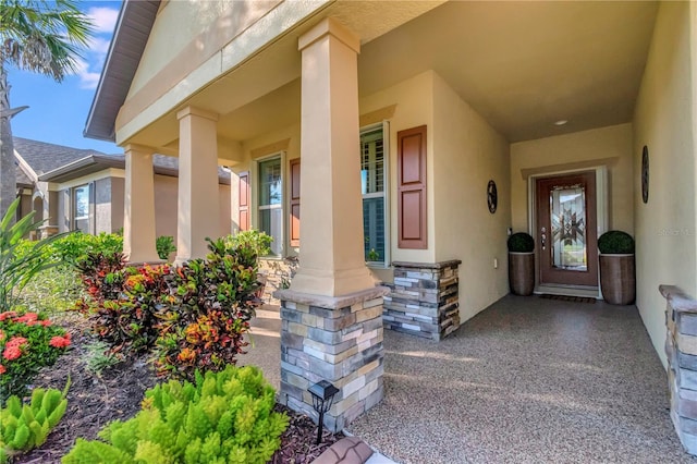 property entrance featuring covered porch