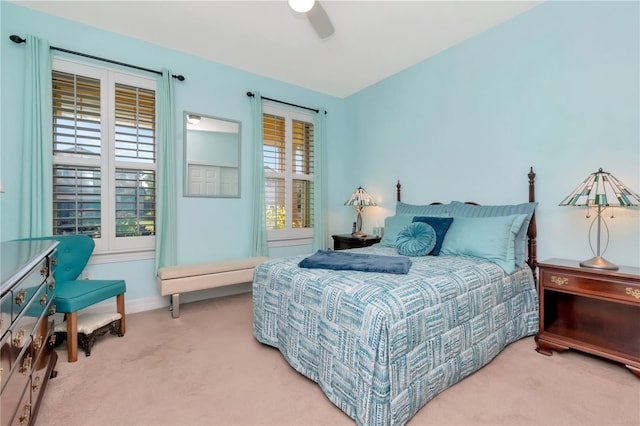 bedroom featuring ceiling fan and carpet