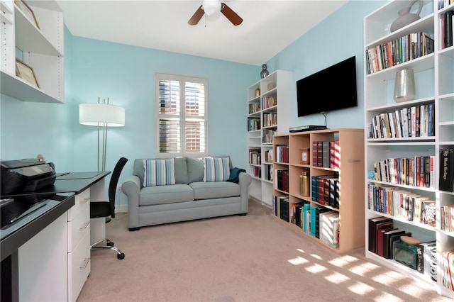 office space featuring ceiling fan and light colored carpet