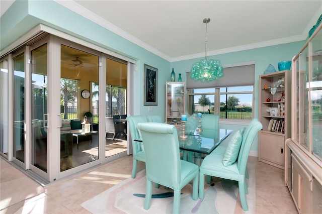 tiled dining space with crown molding, ceiling fan with notable chandelier, and french doors