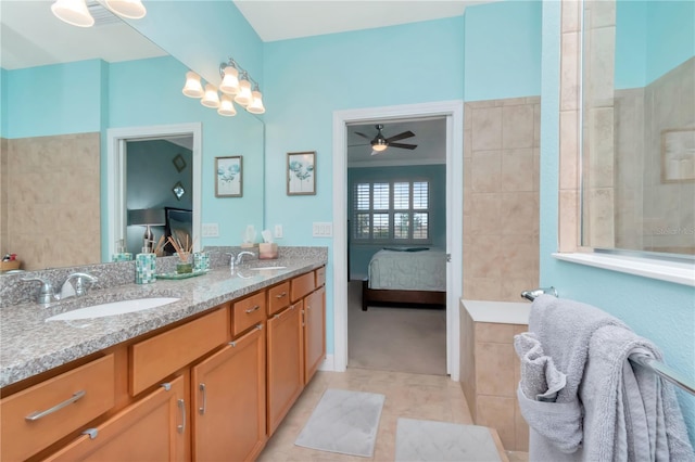 bathroom featuring tile patterned flooring, ceiling fan, and vanity