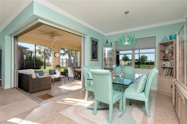 dining space with ceiling fan with notable chandelier and crown molding