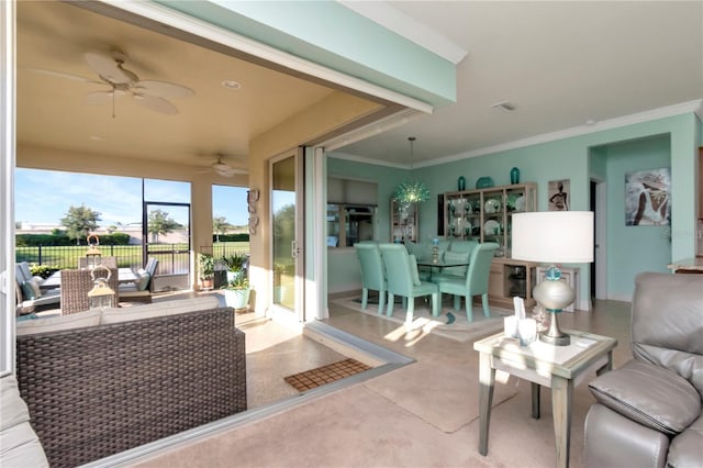 living room with crown molding and ceiling fan