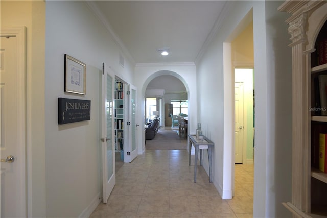 6342 Kenava Loop, Palmetto, FL 34221 - hallway featuring arched walkways, crown molding, and recessed lighting