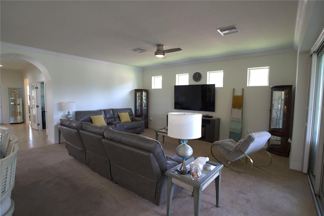 6342 Kenava Loop, Palmetto, FL 34221 - living area with ornamental molding, ceiling fan, arched walkways, and light carpet