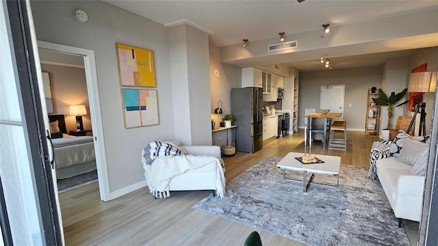 living room with light hardwood / wood-style floors