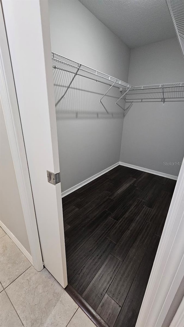 spacious closet with tile patterned flooring