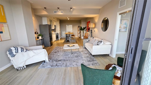 living room featuring light wood-type flooring