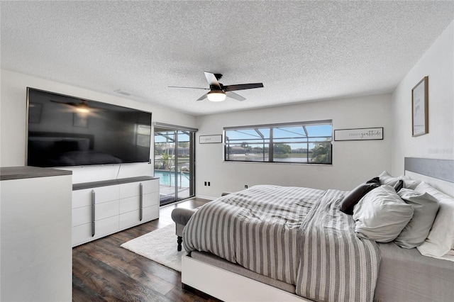 bedroom with access to outside, a textured ceiling, dark wood-type flooring, and ceiling fan