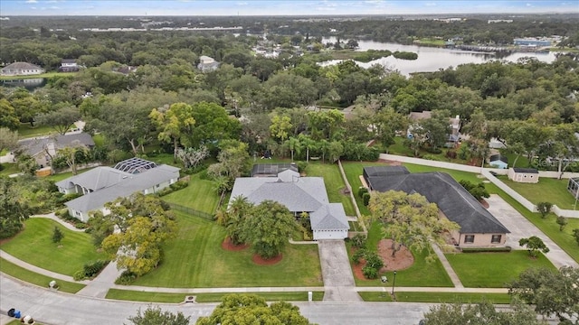 birds eye view of property with a water view