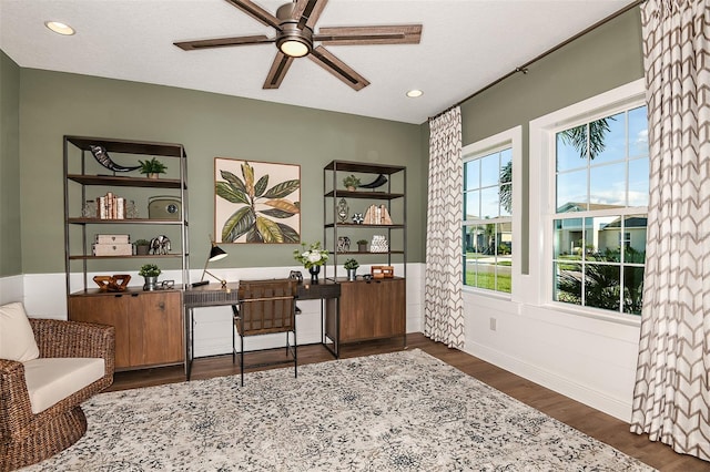 office with dark wood-type flooring, a textured ceiling, and ceiling fan