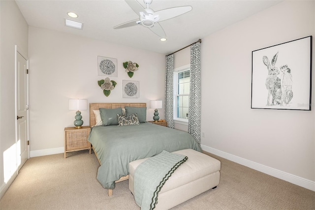 bedroom featuring ceiling fan and light carpet