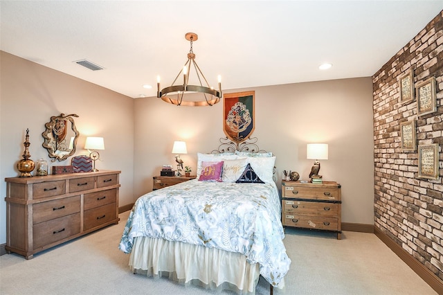 bedroom with light carpet and a chandelier