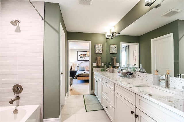 bathroom with vanity, tub / shower combination, a textured ceiling, and tile patterned flooring