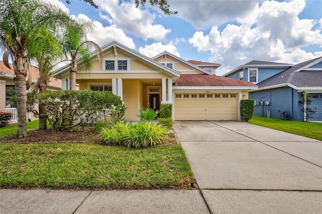 view of front of house with a garage and a front yard