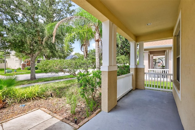 view of patio featuring a porch