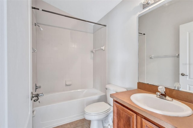 full bathroom featuring tiled shower / bath, vanity, toilet, and tile patterned floors