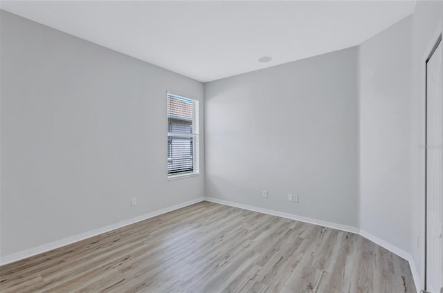 spare room featuring light hardwood / wood-style flooring