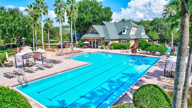 view of swimming pool featuring a patio area