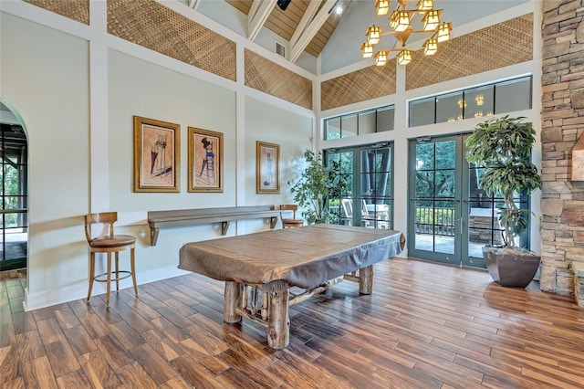 dining room with pool table, a healthy amount of sunlight, and high vaulted ceiling