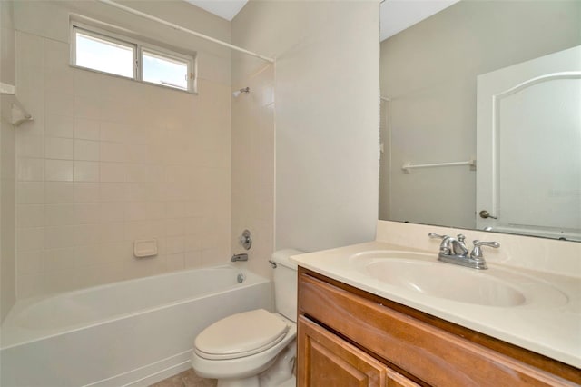 full bathroom with tiled shower / bath combo, vanity, and toilet