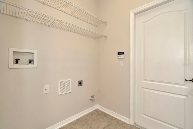 laundry area featuring hookup for a washing machine, electric dryer hookup, and light tile patterned floors