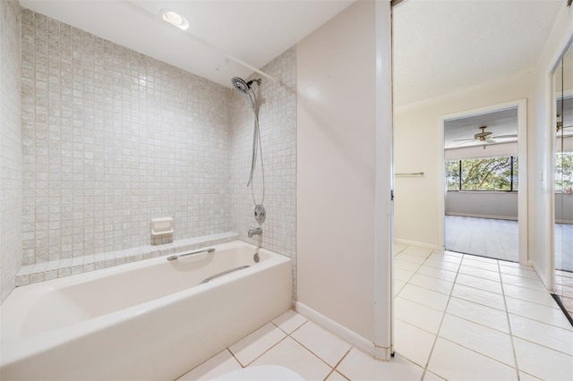 bathroom with tile patterned flooring, ceiling fan, and tiled shower / bath combo