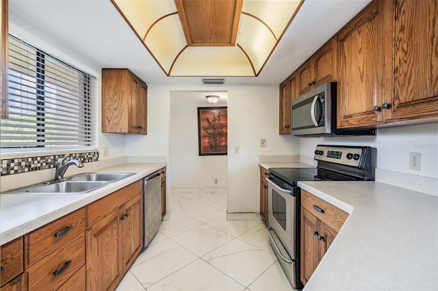 kitchen featuring stainless steel appliances and sink