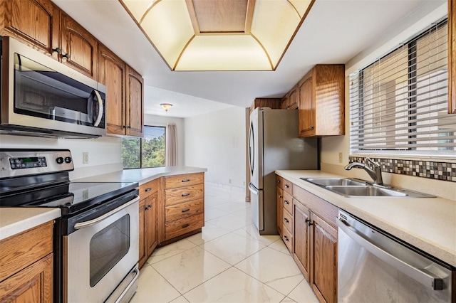 kitchen featuring stainless steel appliances and sink