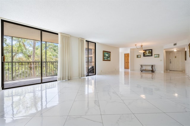 unfurnished living room featuring a wall of windows