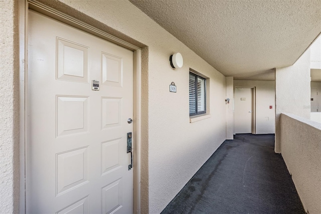 property entrance with a balcony