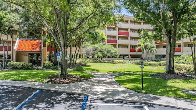 view of property's community with a yard