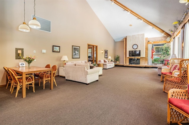 carpeted living room featuring high vaulted ceiling and a brick fireplace