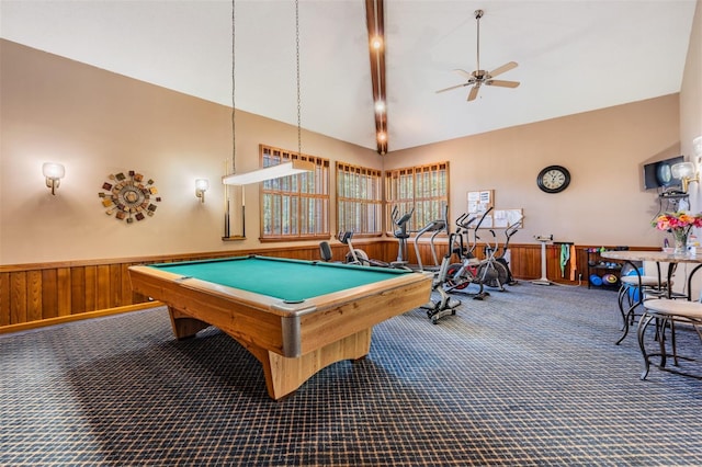 rec room with wood walls, billiards, carpet, high vaulted ceiling, and ceiling fan