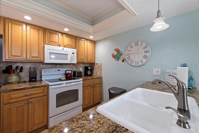 kitchen with white appliances, backsplash, hanging light fixtures, ornamental molding, and sink