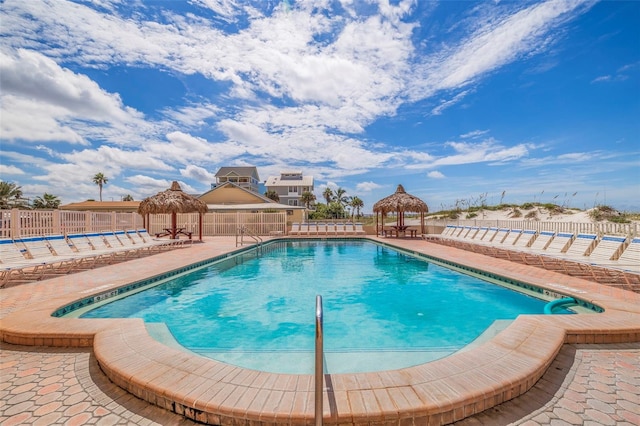 view of swimming pool featuring a patio and a gazebo