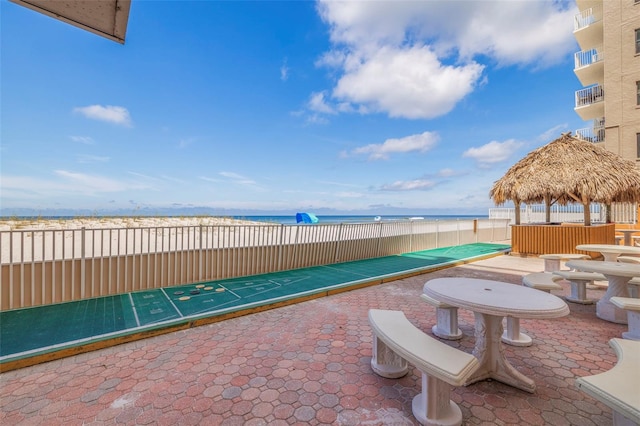 view of patio with a water view