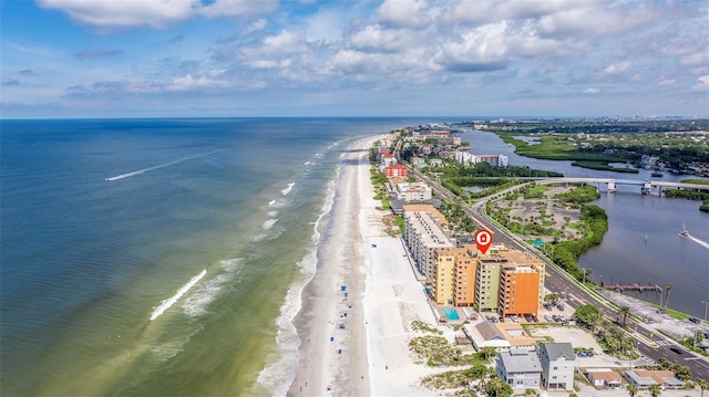 birds eye view of property featuring a water view and a view of the beach