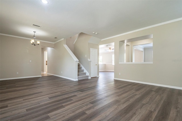 unfurnished living room with crown molding, a notable chandelier, and dark hardwood / wood-style floors