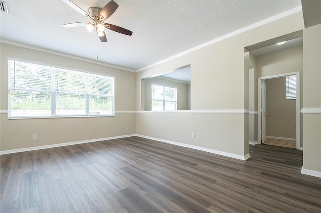 spare room with dark wood-type flooring, ceiling fan, crown molding, and a textured ceiling