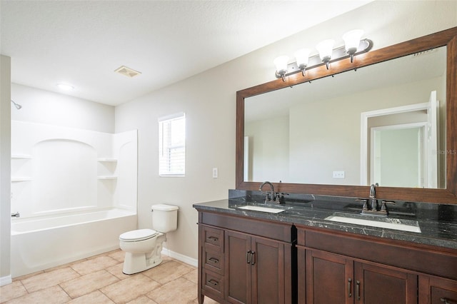 full bathroom featuring toilet, tile patterned floors, vanity, a textured ceiling, and washtub / shower combination