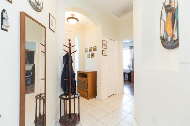 corridor featuring light tile patterned floors