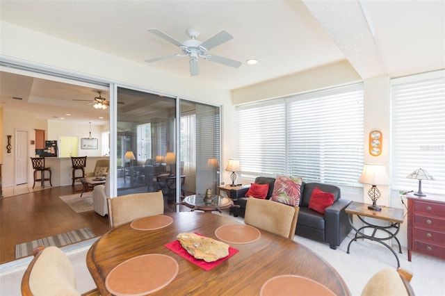 dining area with light hardwood / wood-style floors and ceiling fan